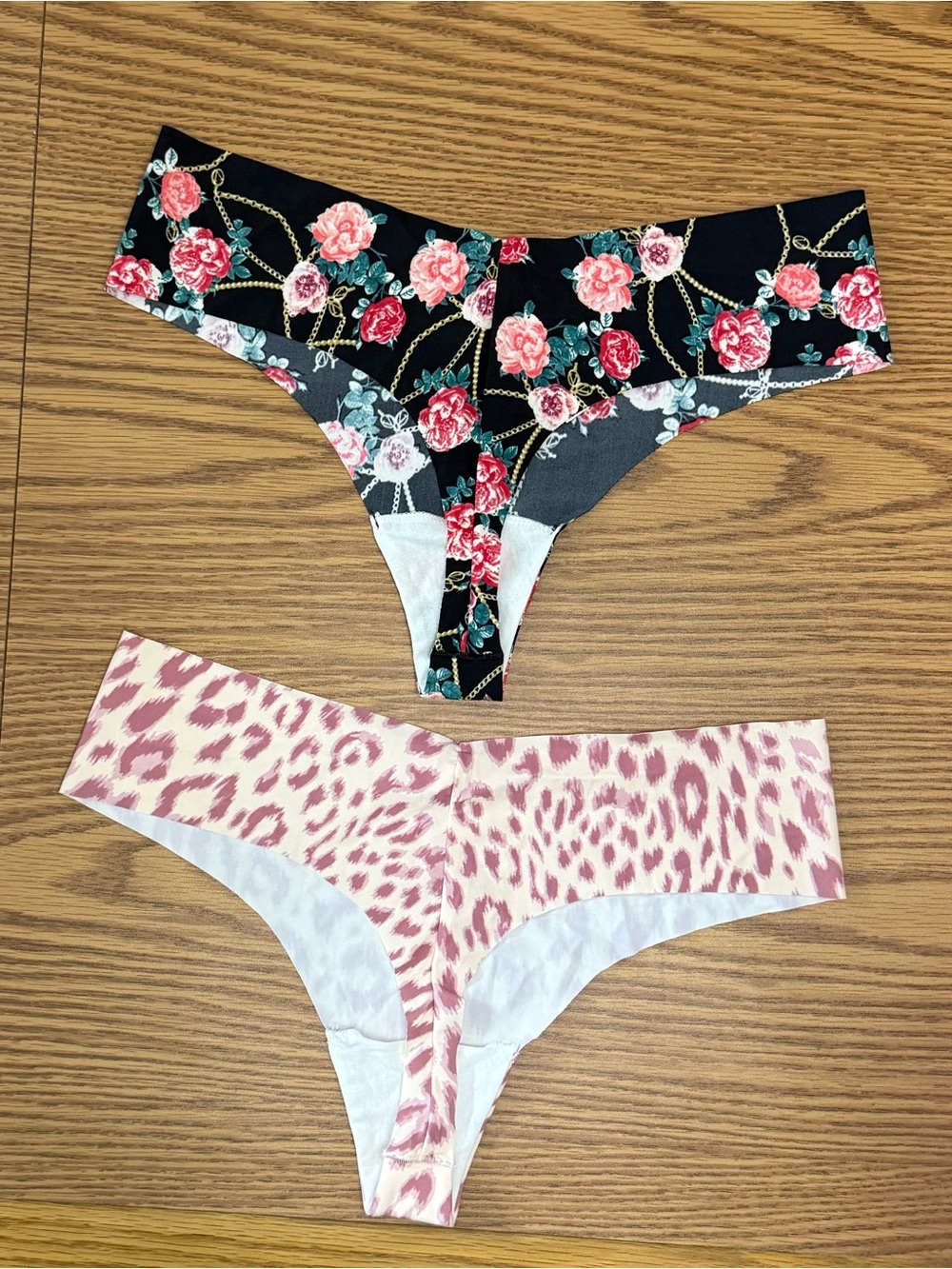NWOT Victoria’s Secret Thong Panties Set of 2...Floral Pink/Black & Cream/Purple